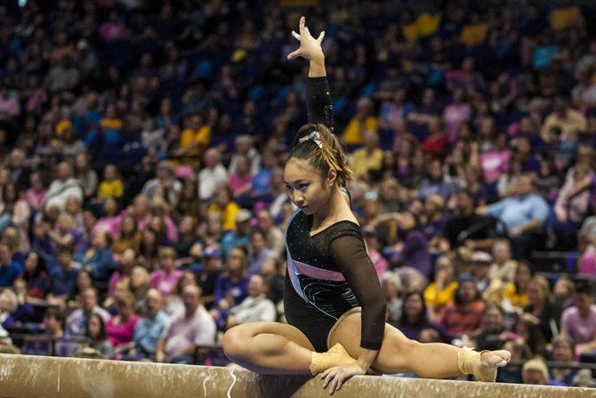 LSU all-around senior Erin Macadaeg competes in the beam competition during the Tigers' 198.175-194.200 victory over Texas Woman's University on Sunday, Feb. 18, 2018.