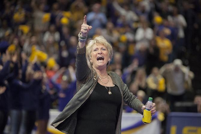 LSU coach D-D Breaux celebrates during the Tigers&#8217; 197.450-196.725 victory against Alabama on Friday, Jan. 19, 2018, in the PMAC.