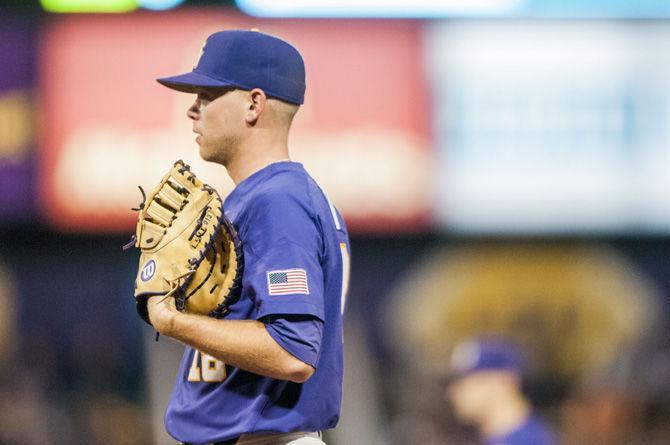 LSU senior pitcher Austin Bain (18) stands at first base during the Tigers&#8217; 5-1 win against Hawaii on Saturday, March 10, 2018, at Alex Box Stadium.