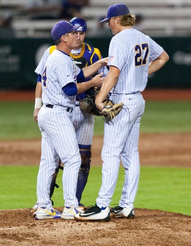 LSU pitching coach Alan Dunn talks with freshman pitcher Matthew Beck (27) on Tuesday, April 18, 2017, during the Tigers&#8217; 10-4 victory over Lamar at Alex Box Stadium.