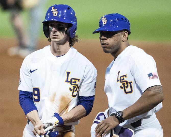 LSU sophomore outfielder Zach Watson (9) talks to LSU coach Leon Landry during the Tigers&#8217; 4-2 win against Missouri on Friday, March 16, 2018, at Alex Box Stadium.