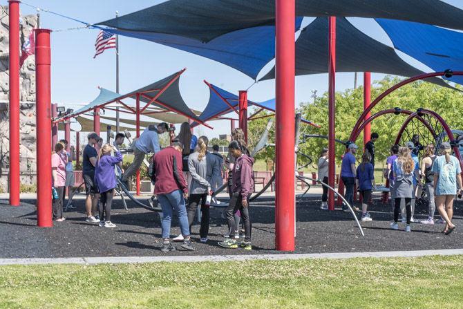 In order to get inspiration for a future project, LSU students gather to experience Perkins Road Community Park&#8217;s playgrounds at the corner of Perkins Road and Kenilworth Parkway on Thursday, March 15, 2018.