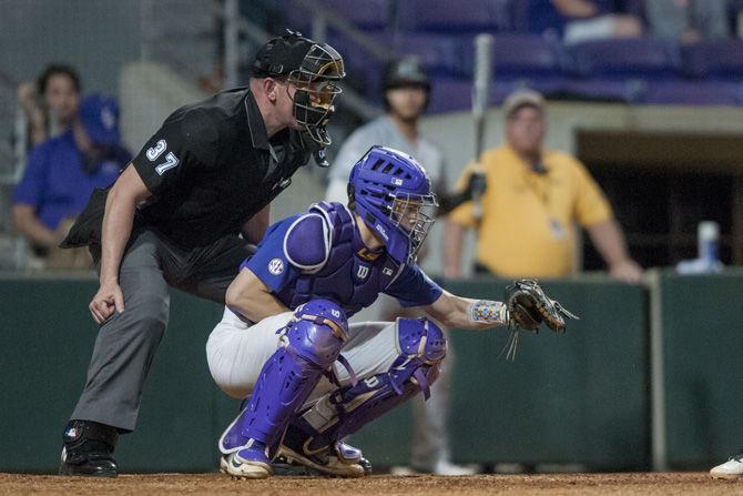 LSU junior catcher Hunter Feduccia (7) catches the ball during the Tigers&#8217; 5-1 win against Hawaii on Saturday, March 10, 2018, at Alex Box Stadium.