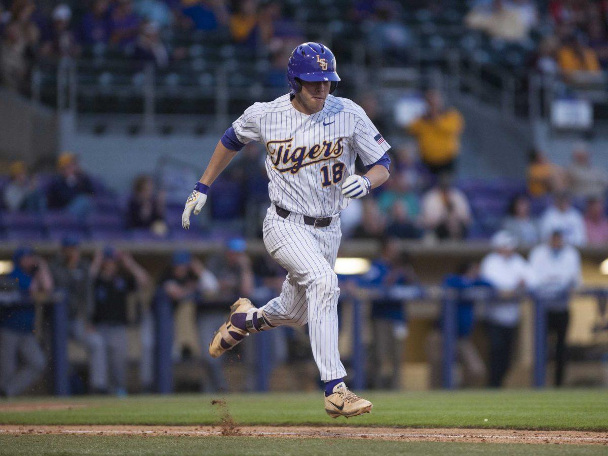 LSU senior right handed pitcher Austin Bain (18) runs to base during the Tigers&#8217; 2-0 victory against Louisiana Tech on Tuesday, April 10, 2018, at Alex Box Stadium.