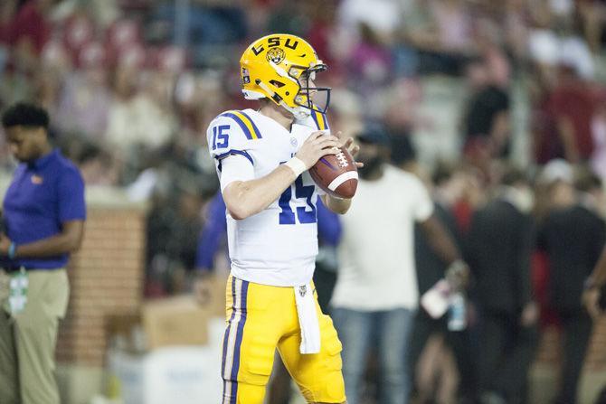 LSU freshman quarterback Myles Brennan (15) practices throwing the football before the Tigers' 10-24 loss to the University of Alabama on Saturday, Nov. 4, 2017, in Bryant&#8211;Denny Stadium in Tuscaloosa.