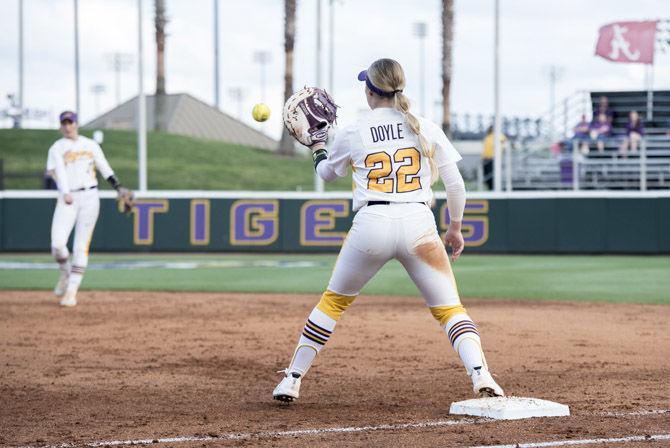 LSU sophomore infielder Amanda Doyle (22) catches the ball for an out during LSU&#8217;s 2-1 victory over University of Mississippi at Tiger Park on Friday, April 6, 2018.