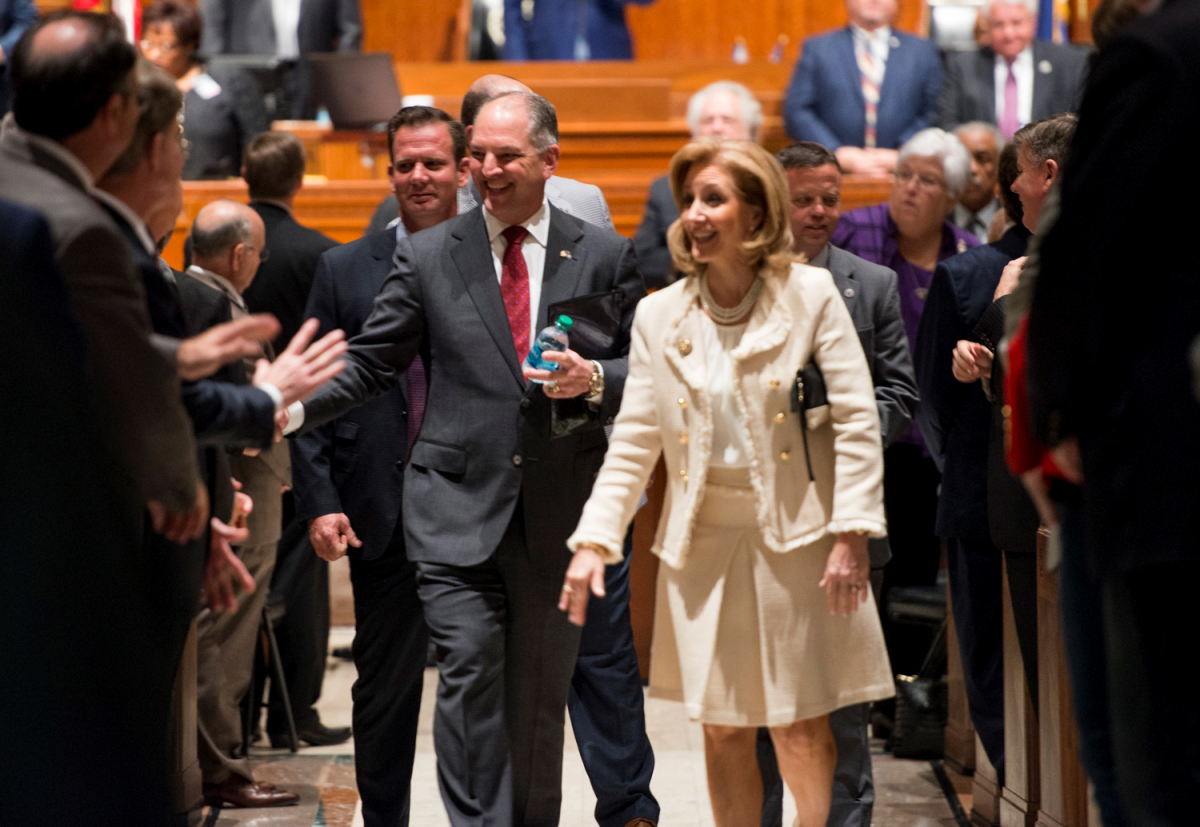 Louisiana Gov. John Bel Edwards and First Lady Donna Edwards leave a joint session of the Legislature Feb. 17, 2017 amid handshakes following his detailing the state&#8217;s fiscal problems and his solutions for solvency.