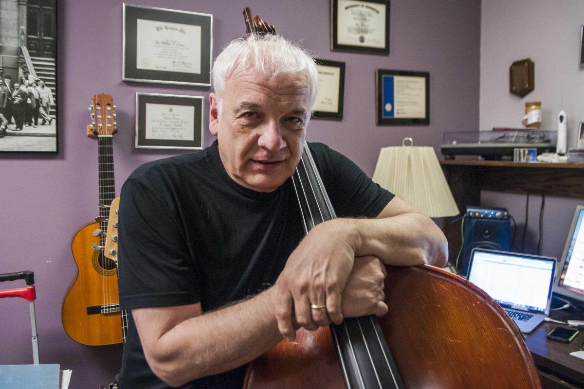 Professor of jazz studies Bill Grimes plays his bass in his office in the School of Music building on Thursday, March 22, 2018.