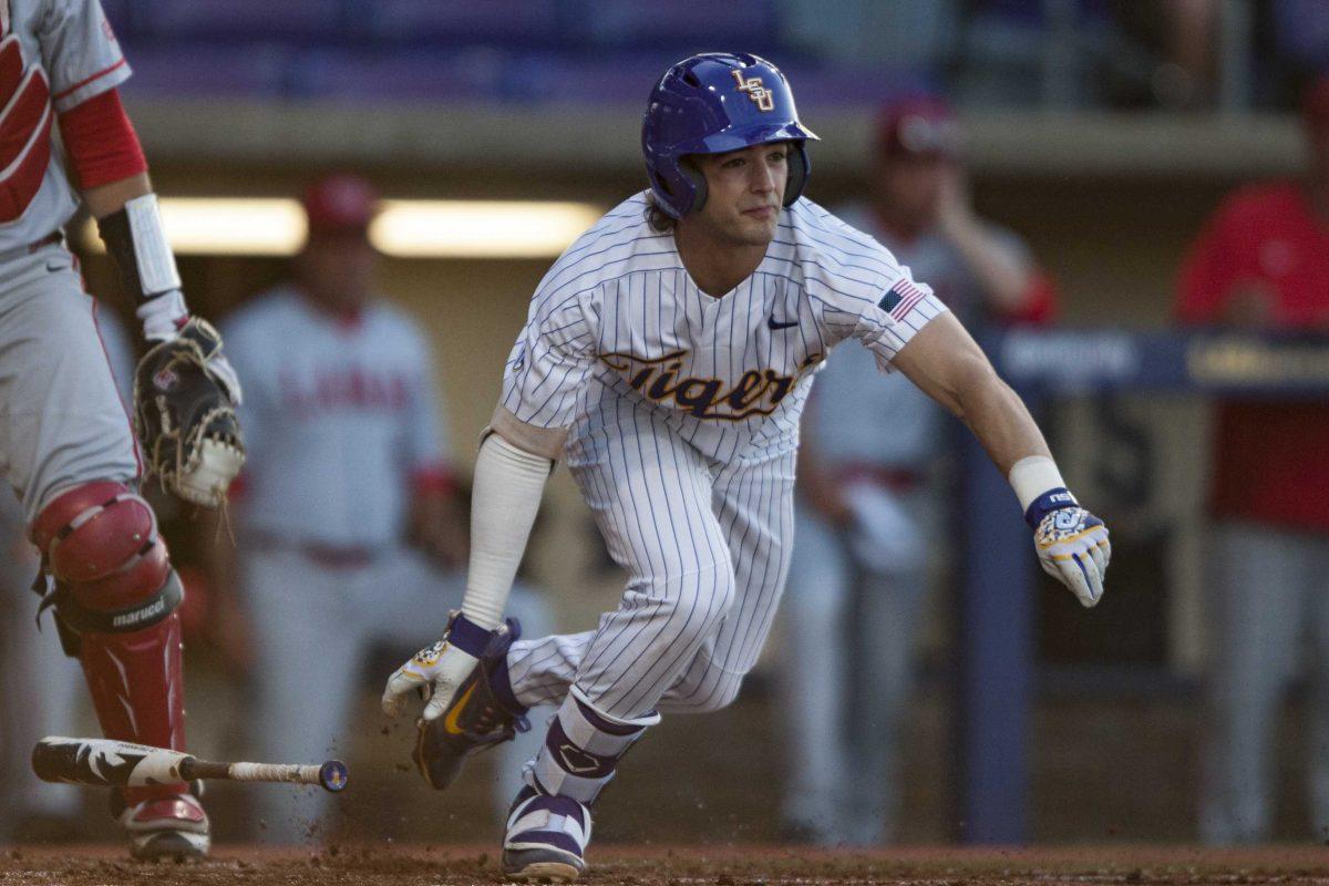 LSU sophomore infielder Josh Smith (4) runs to first base during the Tigers' 8-0 win against Lamar at Alex Box Stadium.