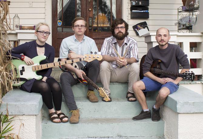 Members of The Nocturnal Broadcast (left to right) Annie Carlson, Drew Brunson, Taylor Stoma and Connor LaCour sit with their instruments on Sunday, March 11, 2018 in downtown Baton Rouge.