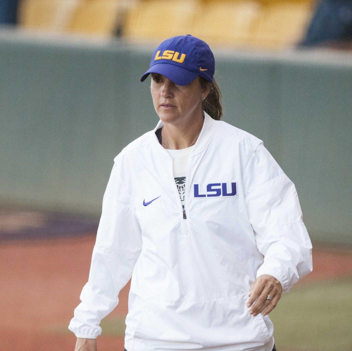 <p>LSU softball coach Beth Torina walks to coach third base during the Tigers' 8-0 win over NSU at Tiger Park on Tuesday, April 17, 2018.</p>