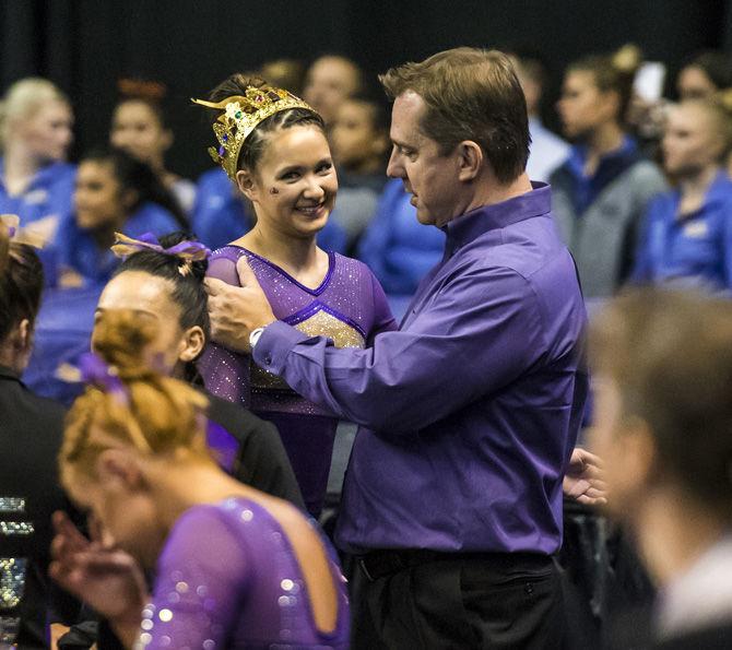 LSU junior Sarah Finnegan hugs coach Jay Clark during the Semifinals of the NCAA Gymnastics Super Six on Friday, April 20, 2018, in Saint Louis, Missouri at the Chaifetz Arena.