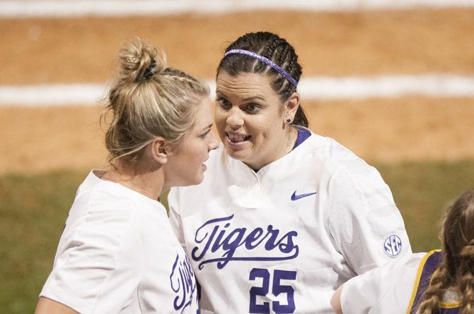 LSU senior pitchers Carley Hoover (21)(left) and Allie Walljasper (25)(right) talk between innings during the Tigers&#8217; 2-1 win against Louisiana Tech on Friday, Feb. 16, 2018, in Tiger Park.