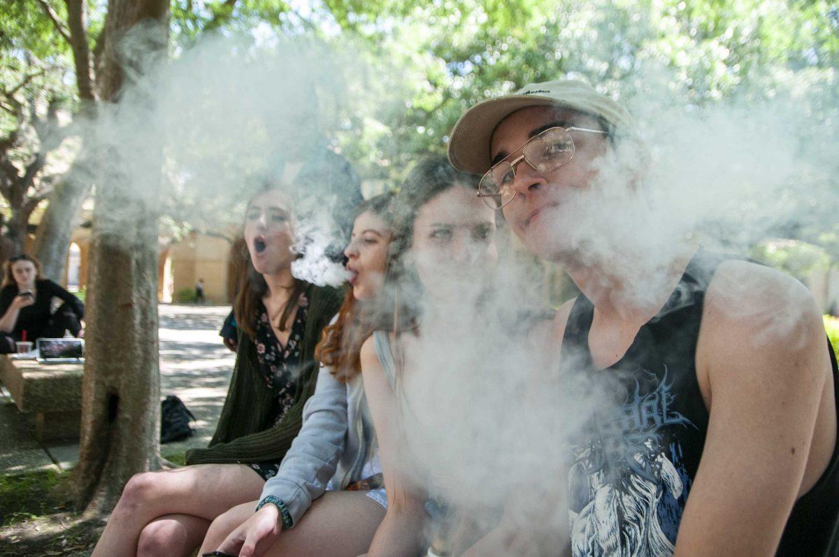 LSU students vape around campus on Tuesday, April 24, 2018.