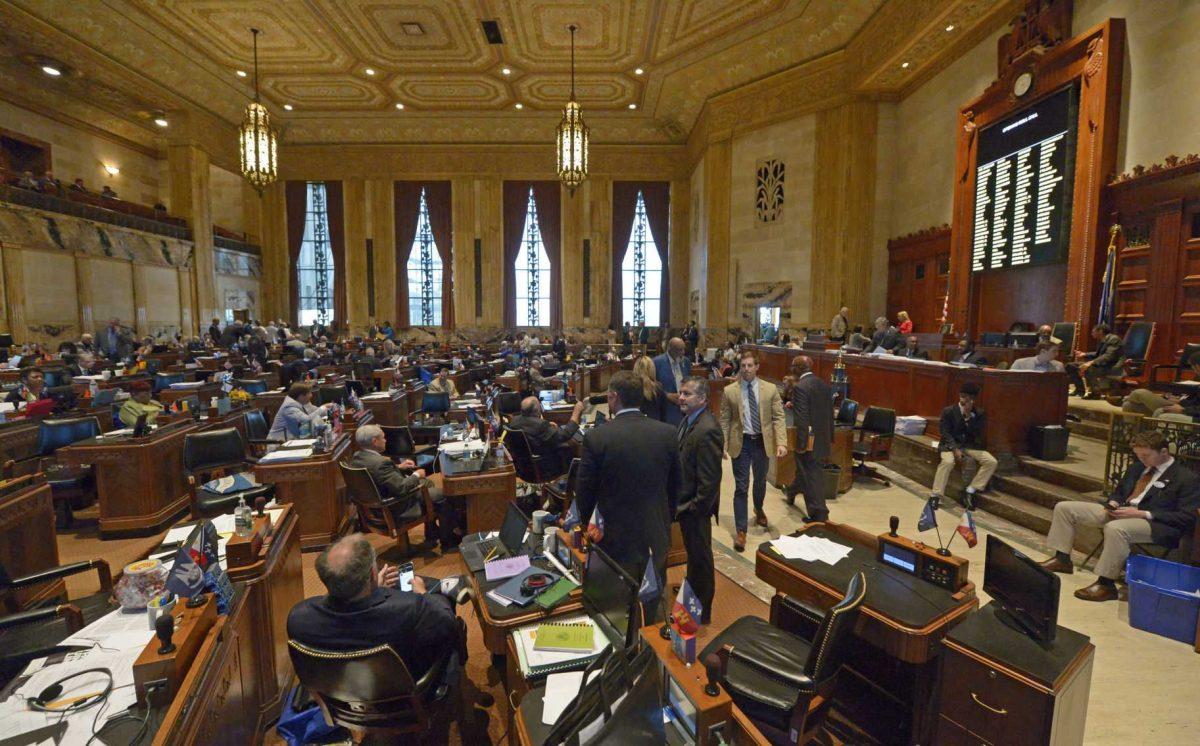 Members of the House of Representatives mingle before the meeting convenes, Tuesday, May 22, 2018, at the start of the legislative special session at the State Capitol in Baton Rouge, La.