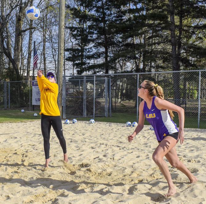 LSU sophomore Claire Coppola (14) and sophomore Kristen Nuss (13) practice on Thursday, March 8, 2018, at Mango's Beach Volleyball Club.