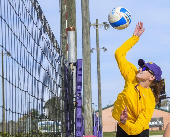 <p>LSU sophomore Kristen Nuss (13) practices on Thursday, March 8, 2018, at Mango's Beach Volleyball Club.</p>