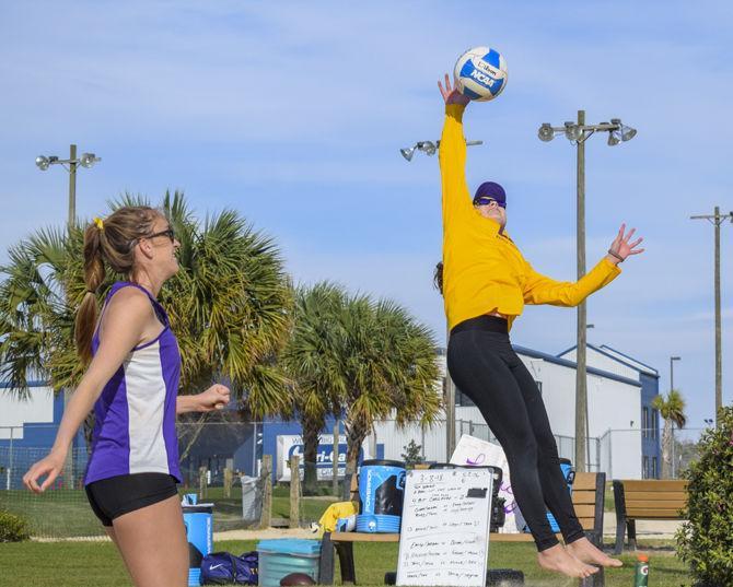 LSU sophomore Claire Coppola (14) and sophomore Kristen Nuss (13) practice on Thursday, March 8, 2018, at Mango's Beach Volleyball Club.