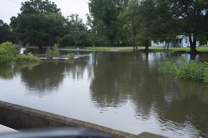 A bridge and road on Aug. 13, 2016 as they are overcome by rising water levels in Ascension Parish.