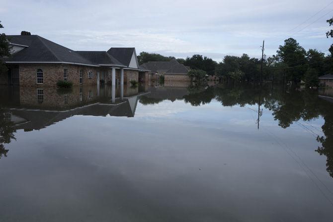 A flooded house sits off of LA Highway 73 on Aug. 13, 2016 as locals wait for for water levels to recede.