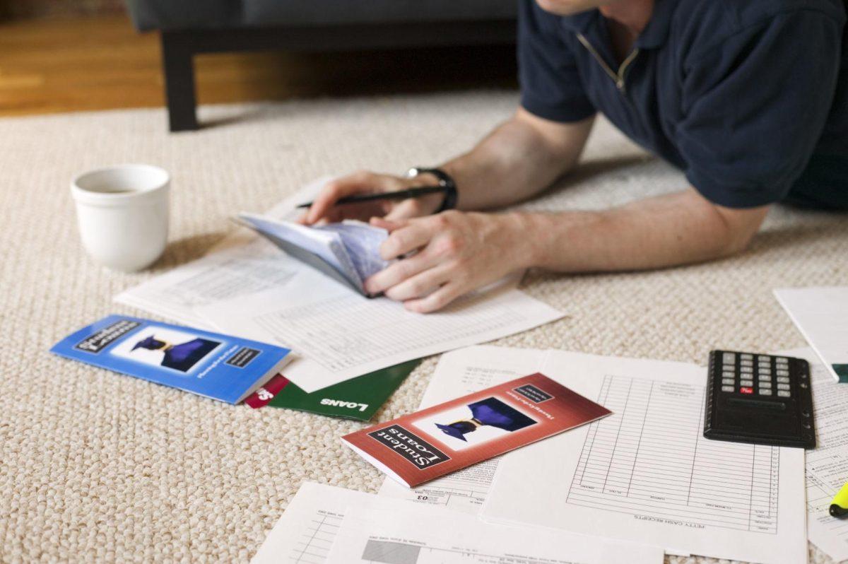 Man with checkbook and paperwork