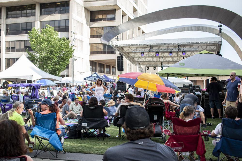 Festival attendees gather around at the Baton Rouge Oyster Festival on Saturday, June 30, 2018.