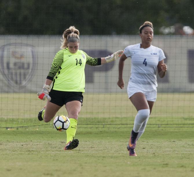 LSU junior goalkeeper Caroline Brockmeier (14) punts the ball while freshman defender Chiara Ritchie-Williams (4) runs up the field during the Tigers' 0-1 loss against Vanderbilt on Sunday, Sept. 17, 2017, at the LSU Soccer Stadium.