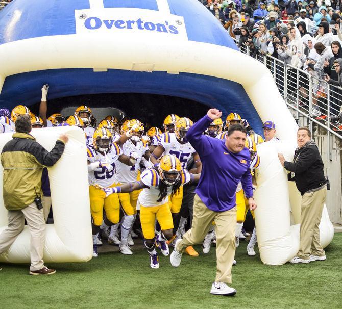 LSU runs out of the locker room led by coach Ed Orgeron during the Tigers' 17-21 loss to Notre Dame in the Citrus Bowl on Monday, Jan. 1, 2018 in Camping World Stadium in Orlando, Florida.