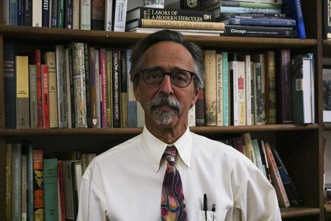 LSU Carol O. Sauer professor of geography Craig E. Colton works in his office in the Howe-Russell Geoscience Complex on Friday, Aug. 24, 2018.