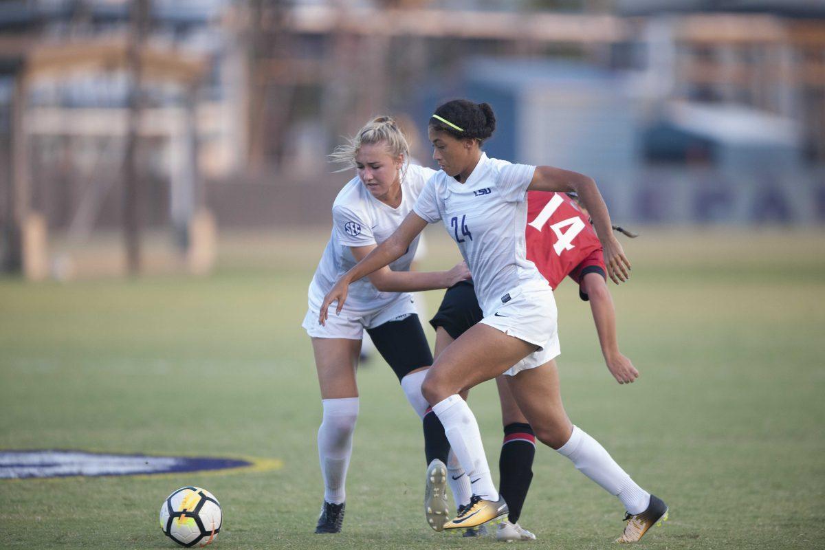 LSU sophomore defender Jade Clarke (24) and LSU sophomore defender and midfielder Marlena Cutura (20) fight Cincinnati freshman Abby Brauning (14) for the ball in LSU's 1-0 win against Cincinnati at the LSU Soccer Complex on Sept. 14, 2017.