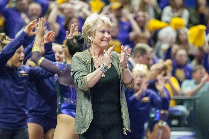 LSU coach D-D Breaux cheers for her team during the Tigers' 197.450-196.725 victory against Alabama on Friday, Jan. 19, 2018, in the PMAC.