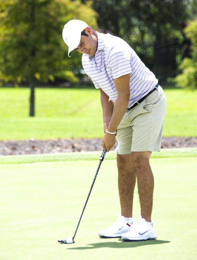 LSU senior Luis Gagne practices on the green at the University Club golf course on Monday, Aug. 27, 2018.