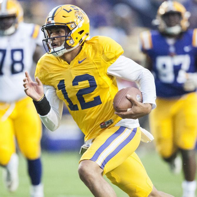 LSU junior quarterback Justin McMillan (12) runs with the ball during the purple team&#8217;s 28-27 victory against the gold team during the Spring Game on Saturday, April 21, 2018, at Tiger Stadium.