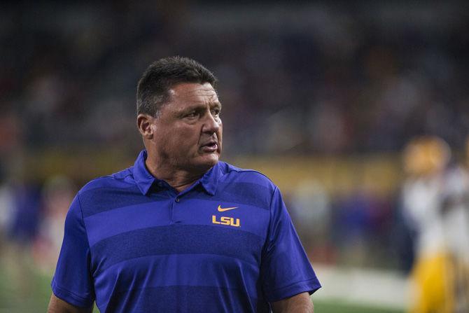 LSU head coach Ed Orgeron paces the field during the Tigers' game against Miami in the AdvoCare Classic on Sunday, Sept. 2, 2018 at AT&amp;T Stadium in Arlington, Texas.