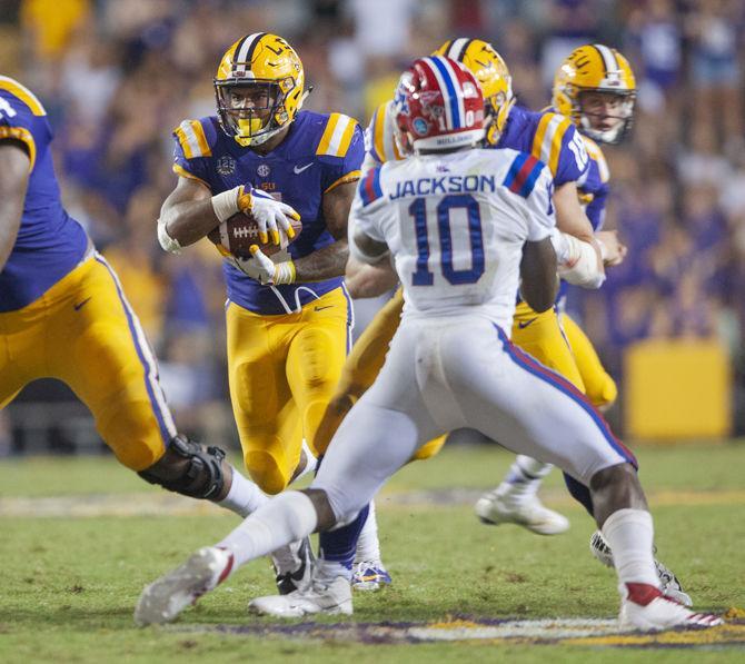 LSU senior running back Nick Brossette (4) runs with the ball during the Tigers' 38-21 win against LA Tech on Saturday, Sept. 22, 2018, at Tiger Stadium.