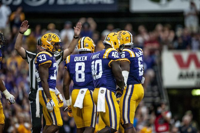 LSU football players celebrate after a touchdown during the Tigers' 38-21 win against LA Tech on Saturday, Sept. 22, 2018, at Tiger Stadium.