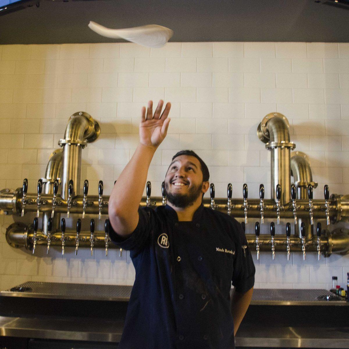 Mitchell Rotolo Jr. tosses pizza dough on Thursday, Oct. 26, 2017, at the newly opened Rotolo's on 411 Ben Hur Road.