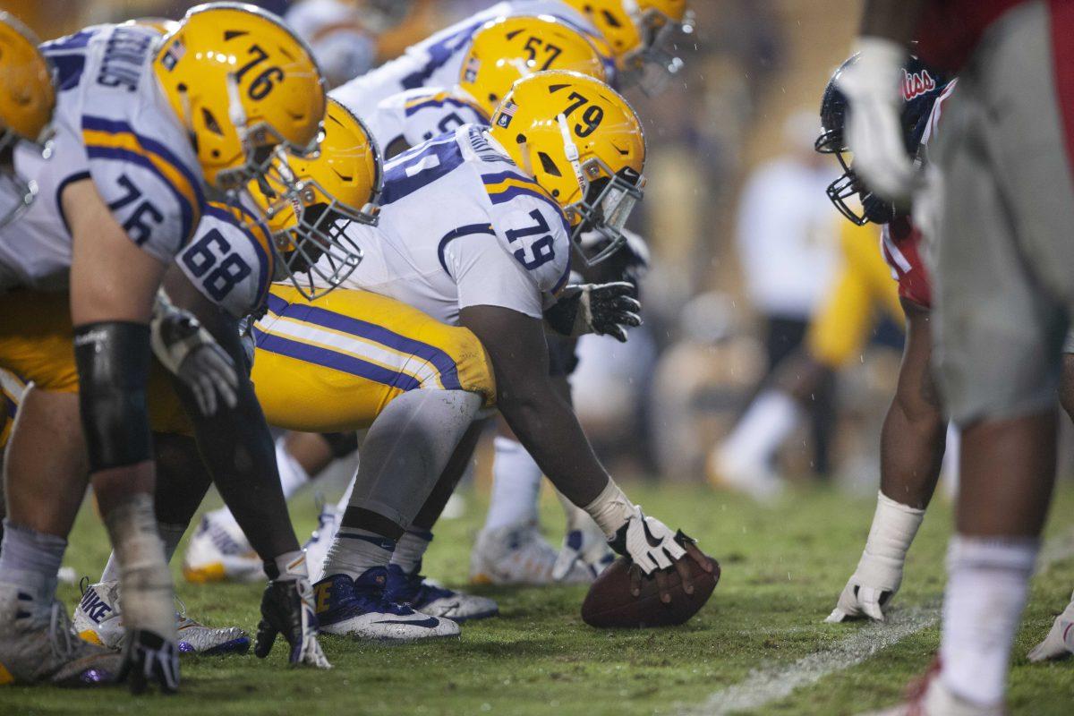 LSU sophomore center Lloyd Cushenberry III (79) preparing to snap the ball during the 45-16 victory against Ole Miss in Tiger Stadium on Saturday, Sept. 29, 2018.