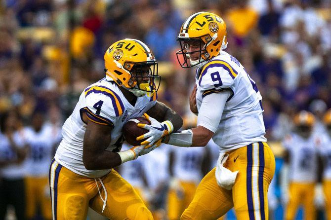 LSU junior quarterback Joe Burrow (9) hands the ball to LSU senior running back Nick Brossette (4) during the Tigers&#8217; 31-0 victory over Southeastern on Saturday, Sept. 8, 2018, in Tiger Stadium.