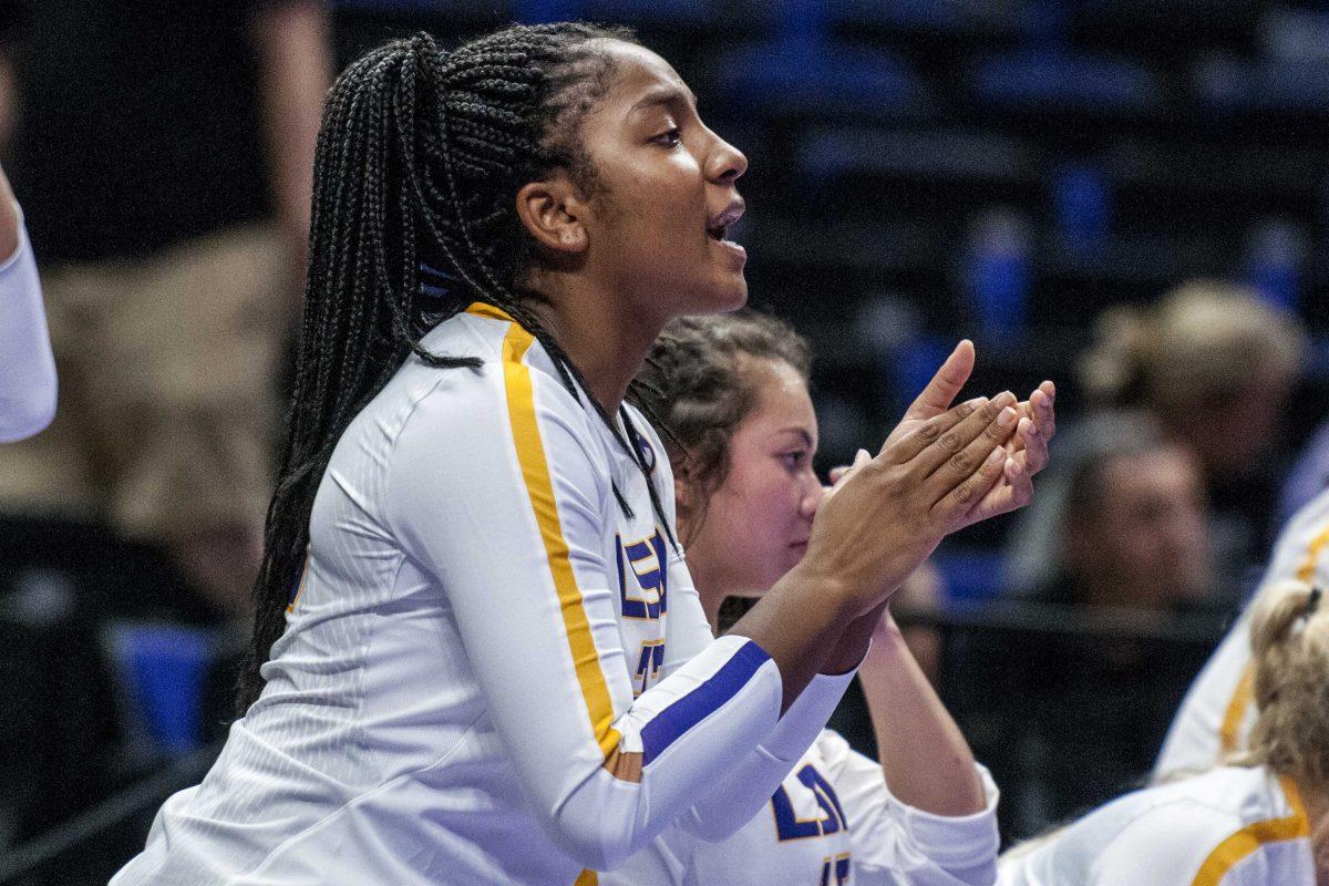 LSU freshman outside hitter Paige Hilliard (23) cheers on her team from the sidelines during the Lady Tigers' 1-3 loss in the PMAC against Duke on Friday, Aug. 31, 2018.