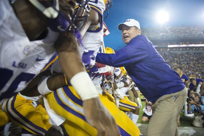 LSU Tigers head coach Les Miles holds back his team before entering onto the field at the start of the game on Saturday Sept. 10, 2016, in Tiger Stadium.