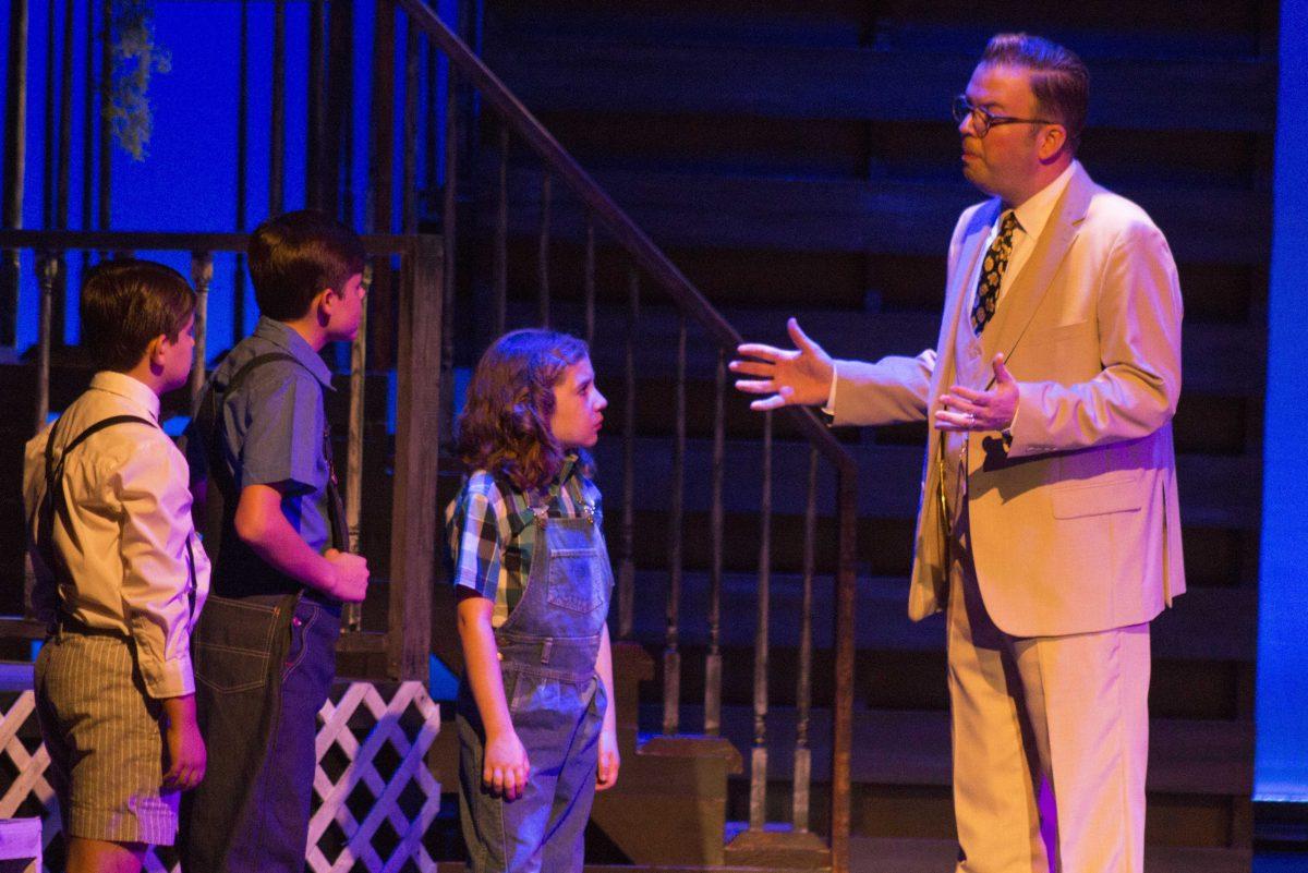 Pete Rizzo playing Atticus Finch talks to Scout, Jem and Dill during Theatre Baton Rouge's performance of To Kill A Mockingbird on Sept. 21, 2017. Theatre Baton Rouge will run the show from Sept. 22 through Oct. 8, 2017.