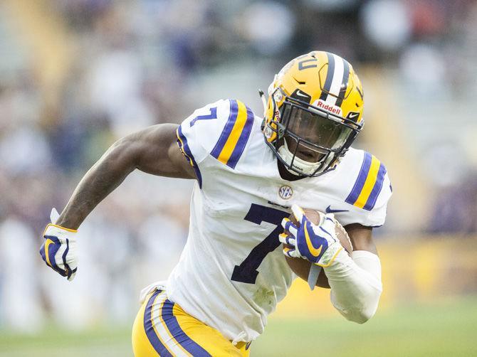 LSU junior wide receiver Jonathan Giles (7) runs with the ball during the purple team&#8217;s 28-27 victory against the gold team during the Spring Game on Saturday, April 21, 2018, at Tiger Stadium.