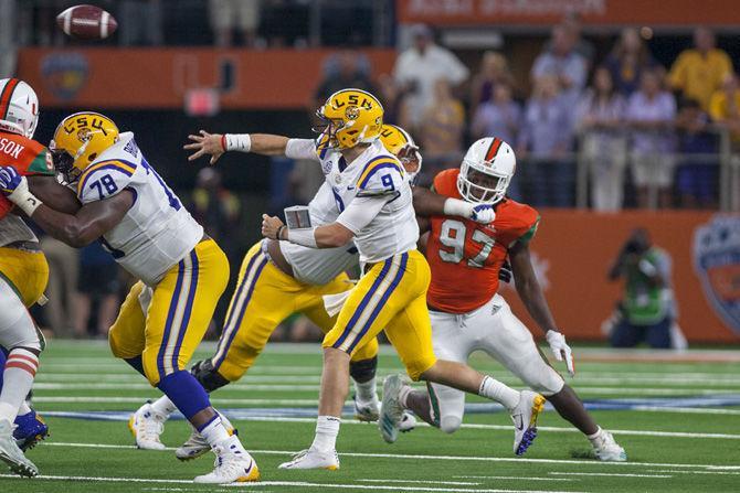 LSU junior quarterback Joe Burrow (9) throws the ball during the Tigers' 33-17 victory over Miami in the AdvoCare Classic on Sunday, Sept. 2, 2018 at AT&amp;T Stadium in Arlington, Texas.