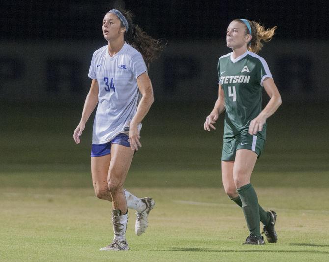 LSU freshman forward Molly Thompson (34) walks alongside Stetson's freshman midfielder Erin Mcrae (4) during the Tigers' 2-0 win over the Stetson Hatter's on Thursday, Sept. 6, 2018, at the LSU Soccer Complex.