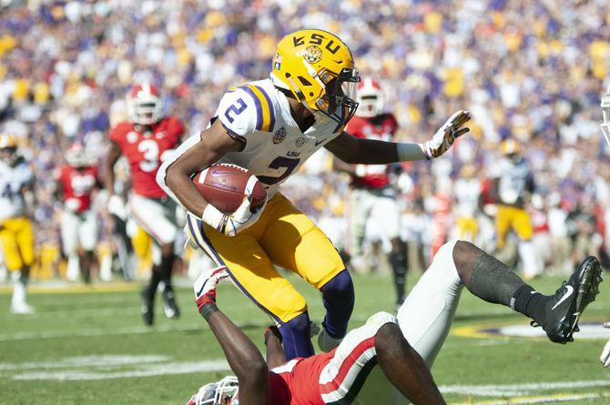 LSU sophomore wide receiver Justin Jefferson (2) runs the ball down the field avoiding Georgia opponet on Saturday, Oct. 13,2018.