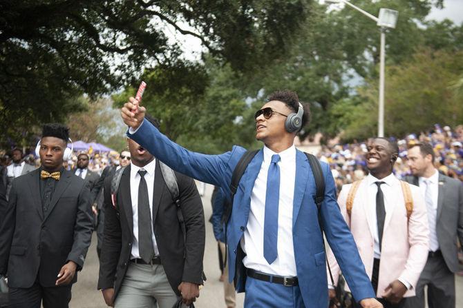 LSU football players walk down Victory Hill on Saturday, Sept. 22, 2018.