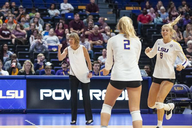 LSU women&#8217;s volleyball coach Fran Flory cheers after a point during the Lady Tigers&#8217; 2-3 loss against Texas A&amp;M in the PMAC on Sunday Sept. 30, 2018.