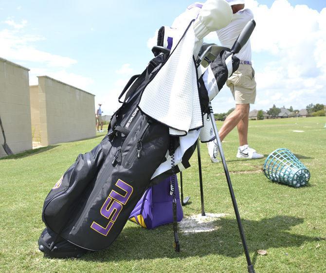 A bag of clubs sits during practice at the University Club golf course on Monday, Aug. 27, 2018.