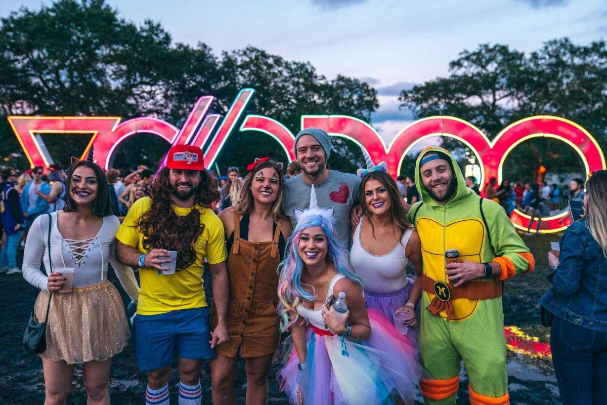 Festival goers pose in Halloween costumes and festival clothes at the 2018 Voodoo Music + Arts Experience.&#160;